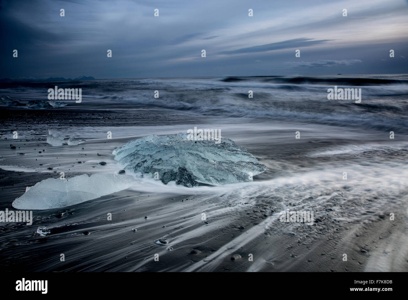 Ice on stormy cold ocean beach, Jokulsarlon, Iceland Stock Photo