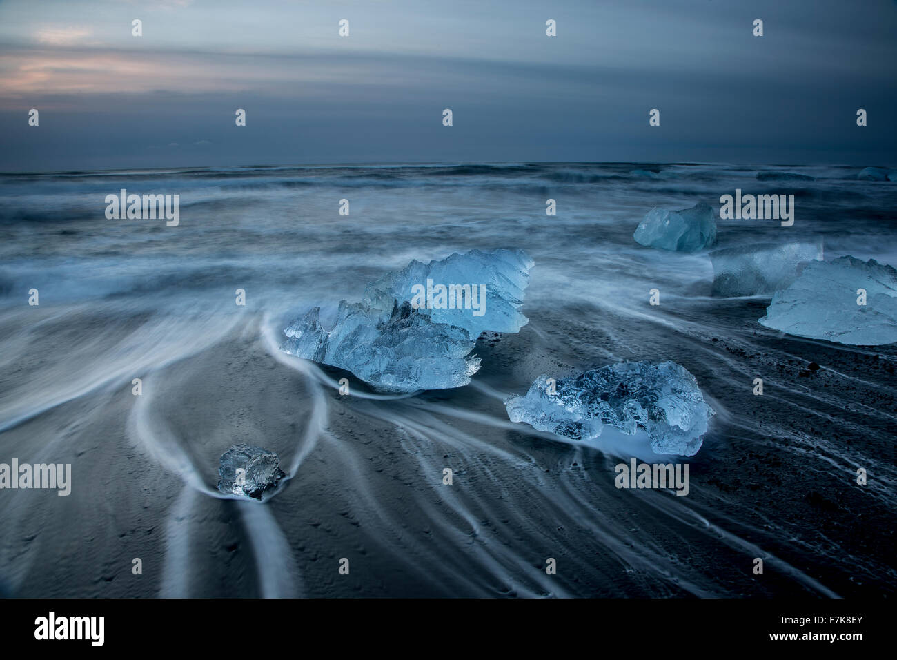 Long exposure of ice on cold stormy ocean beach, Jokulsarlon, Iceland Stock Photo