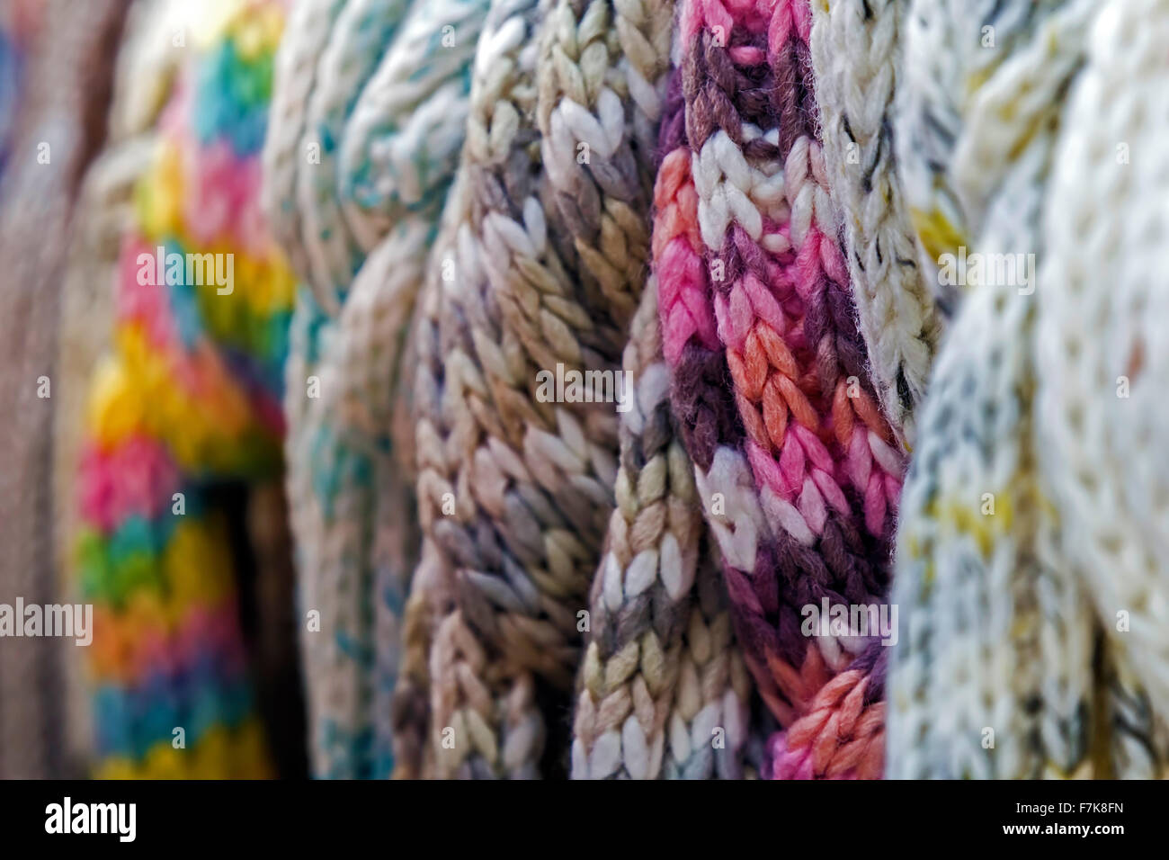 Wool scarves of various colors, exposed for sale. Stock Photo