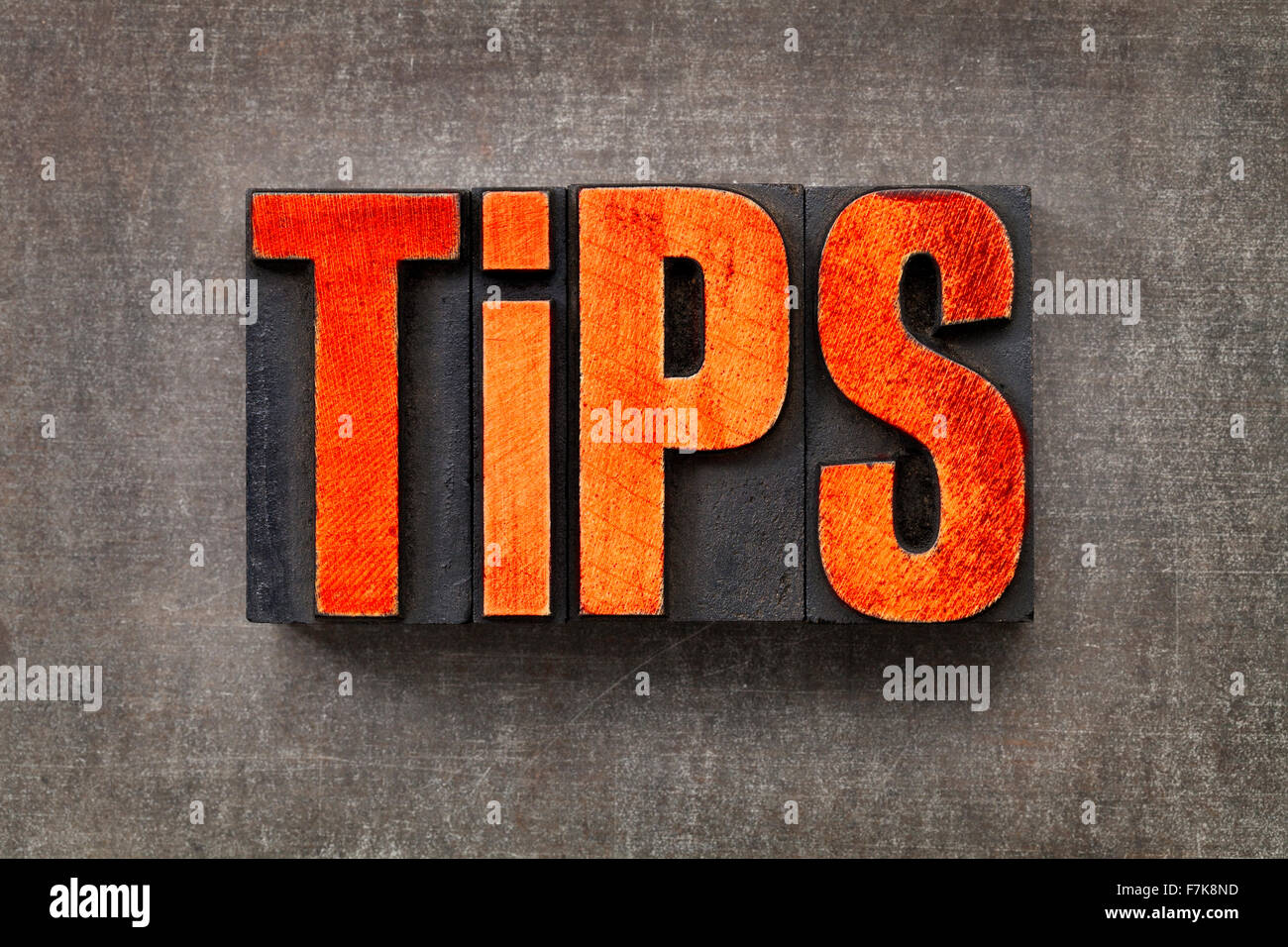 tips word - text in vintage letterpress wood type stained by red ink