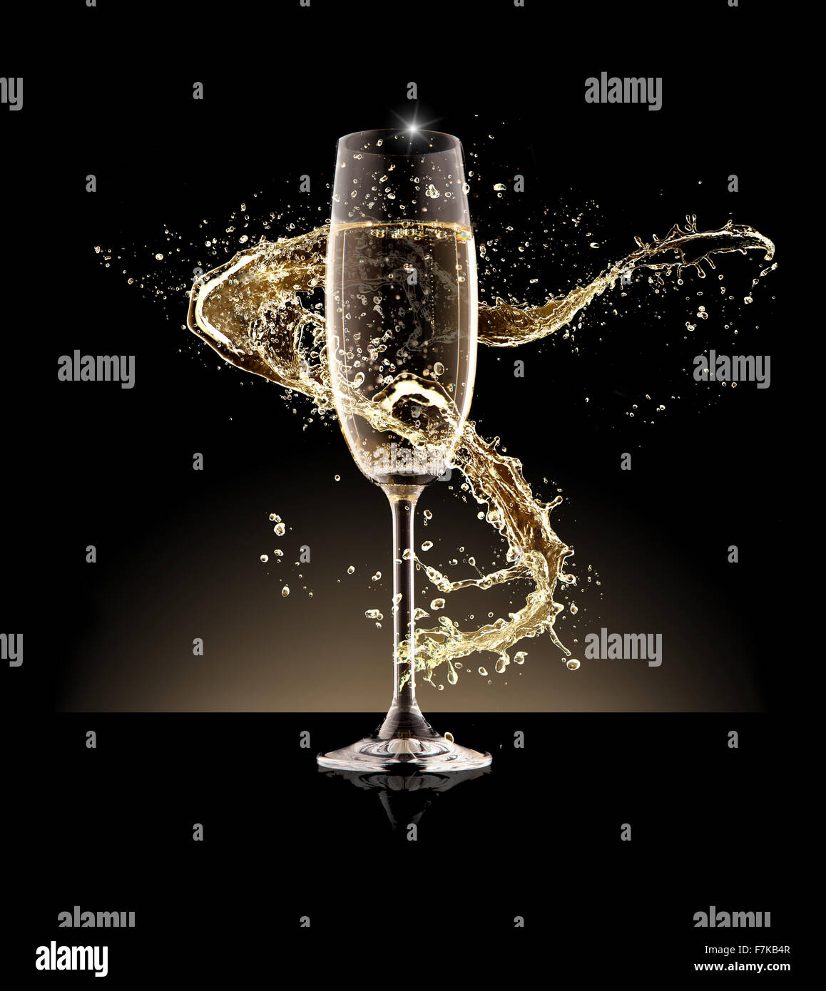 Glass of champagne with splash, isolated on black Stock Photo