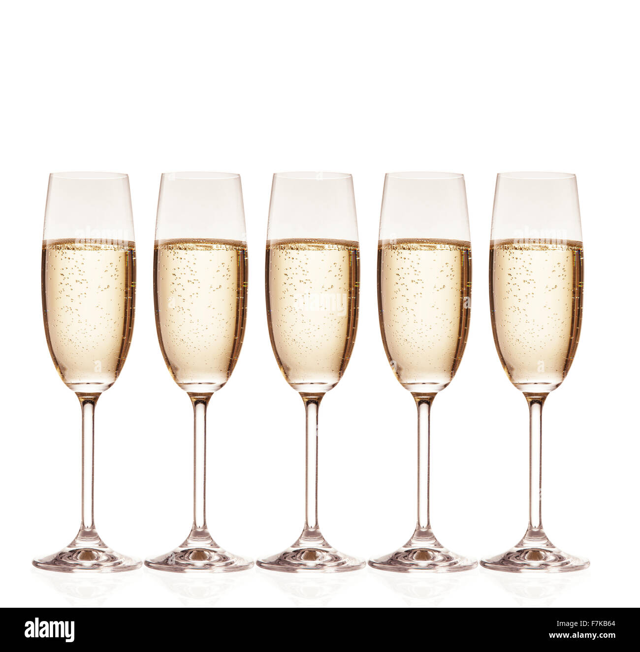 Glasses of champagne with bubbles, isolated on white Stock Photo