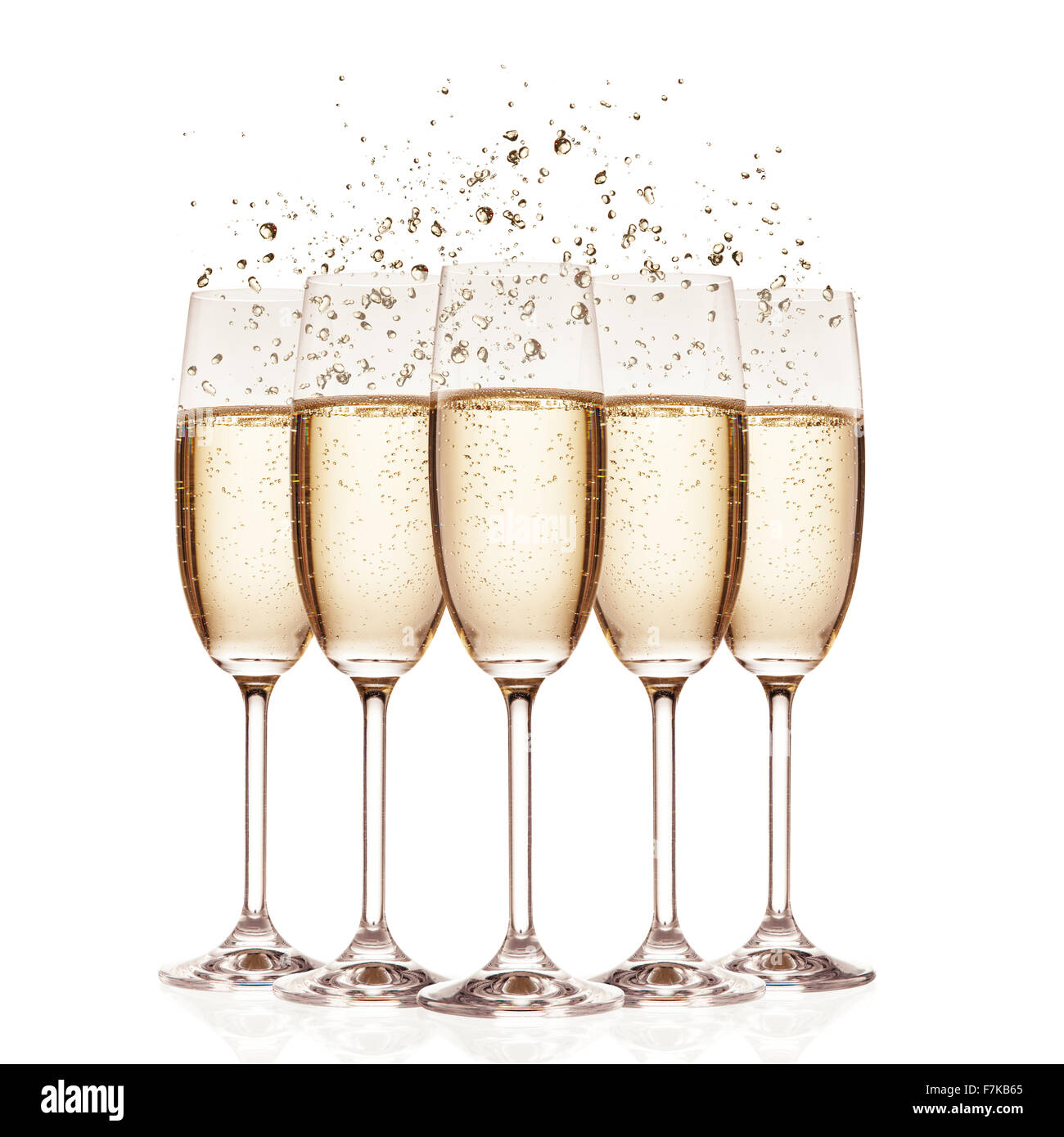 Glasses of champagne with bubbles, isolated on white Stock Photo