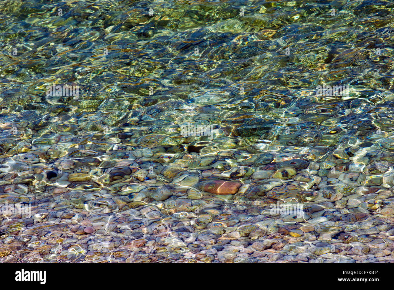 Port de Soller water clarity with stones Stock Photo