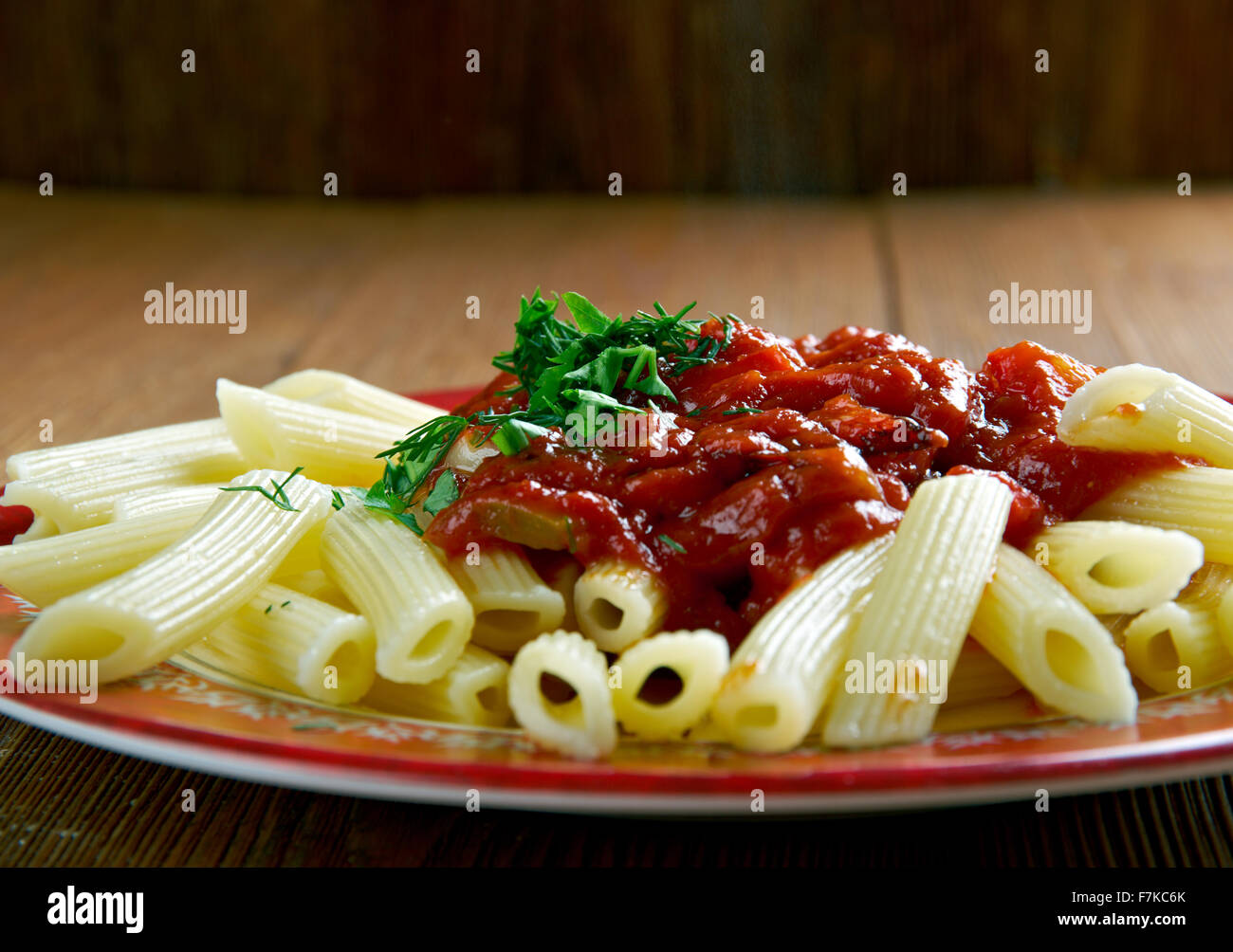 Penne pasta with sauce arrabiata. spicy sauce for pasta made from garlic, tomatoes, and red