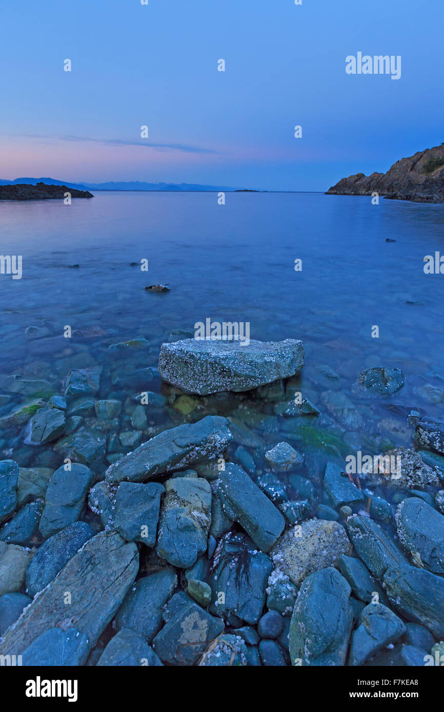 Sunset over the Strait of Georgia from Pipers Lagoon Municipal Park, north Nanaimo, Vancouver Island, British Columbia Stock Photo