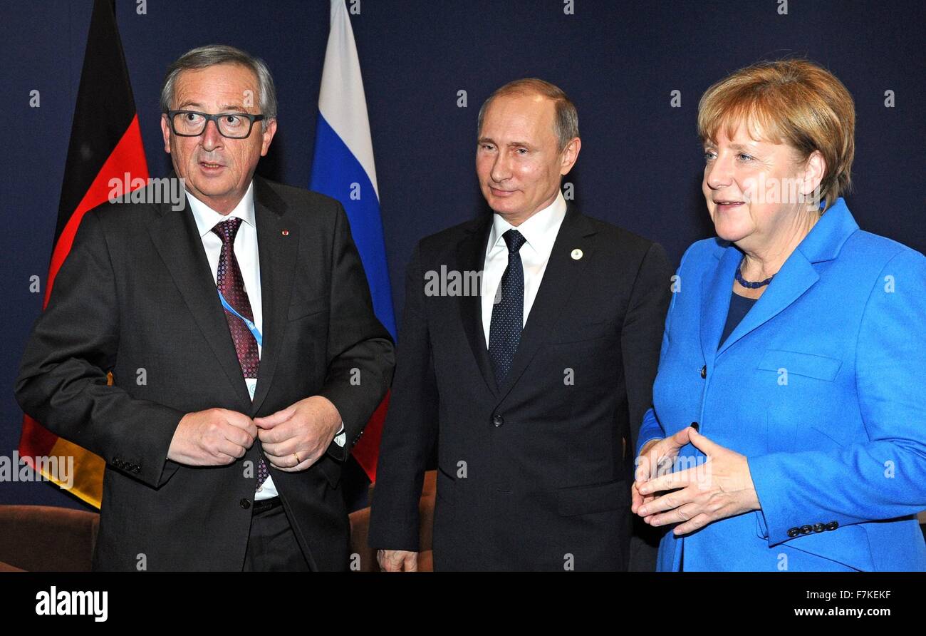 Russian President Vladimir Putin during a trilateral meeting with German Chancellor Angela Merkel and European Union President Jean-Claude Juncker on the sidelines of the COP21, United Nations Climate Change Conference November 30, 2015 in Paris-Le Bourget, France. Stock Photo