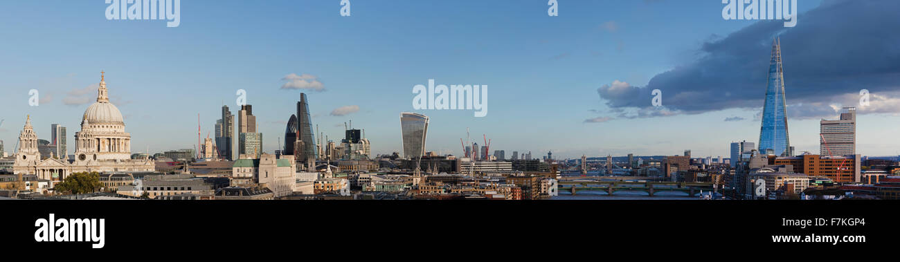 Panoramic skyline view of London including St Pauls The Gherkin River Thames Tower Bridge Millennium Bridge and the Shard. Stock Photo