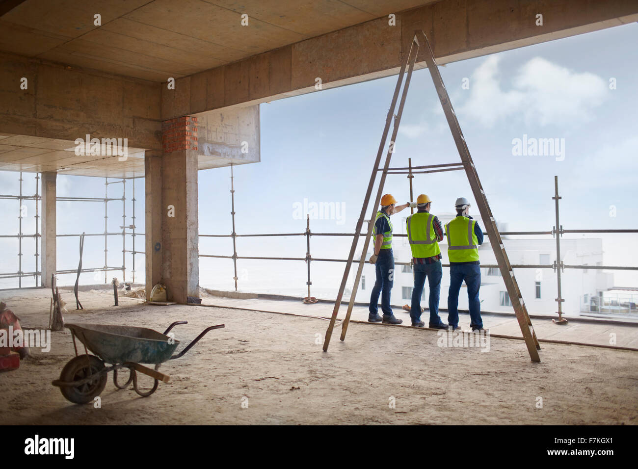 Construction workers at highrise construction site Stock Photo