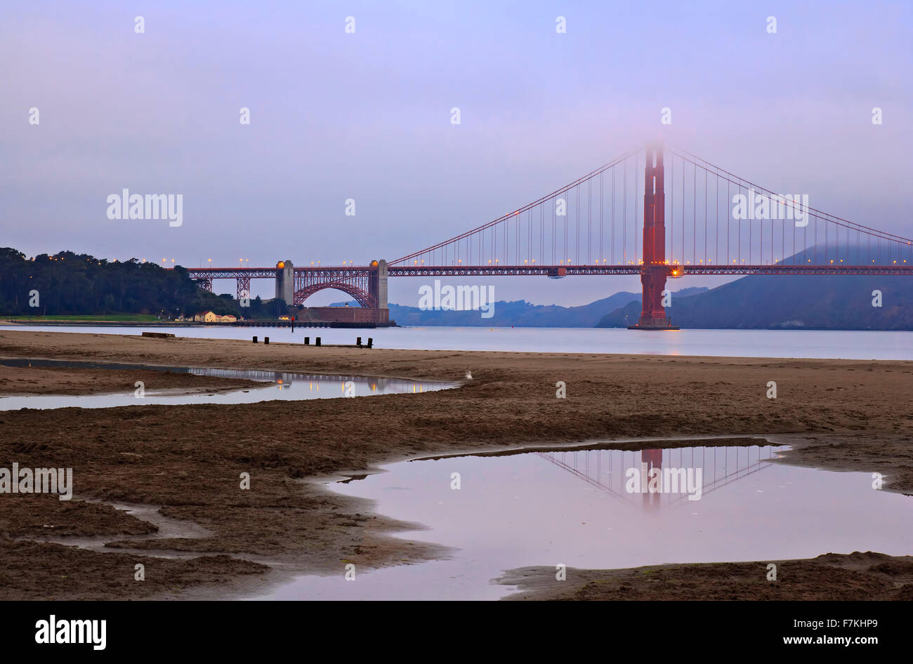 Golden Gate Bridge reflected in pond (in Crissy Field) and fog, San Francisco, California USA Stock Photo