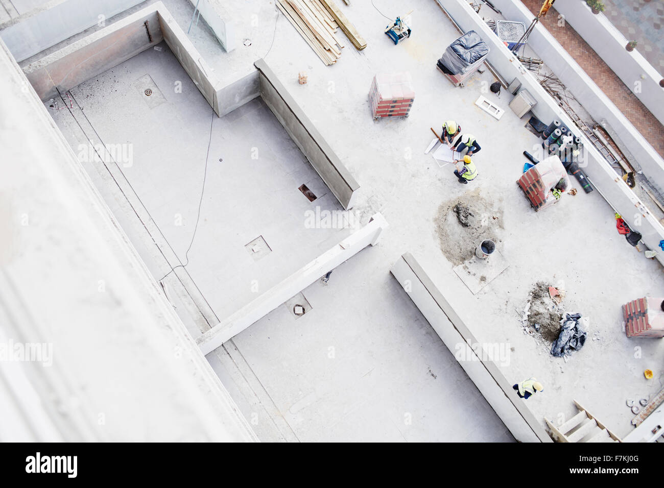 Overhead view of construction workers at construction site Stock Photo