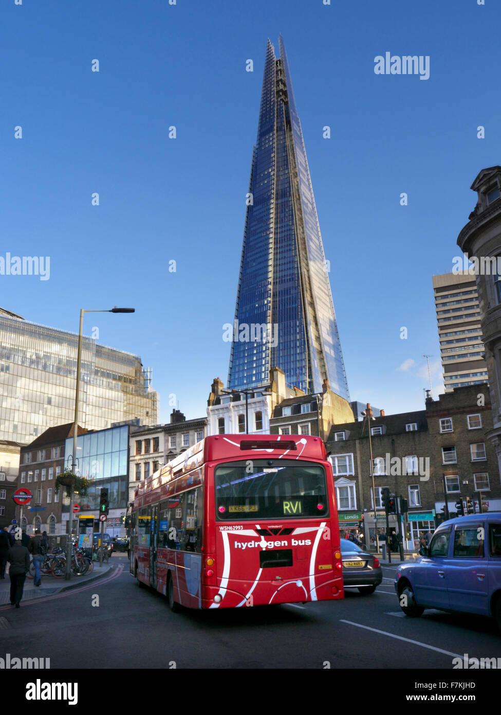 HYDROGEN LONDON BUS with The London Shard with new clean technology hydrogen powered red London bus in foreground  London UK Stock Photo