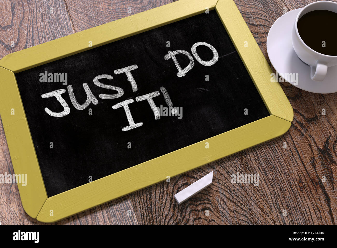 Just Do It. Motivational Quote on Chalkboard. Stock Photo