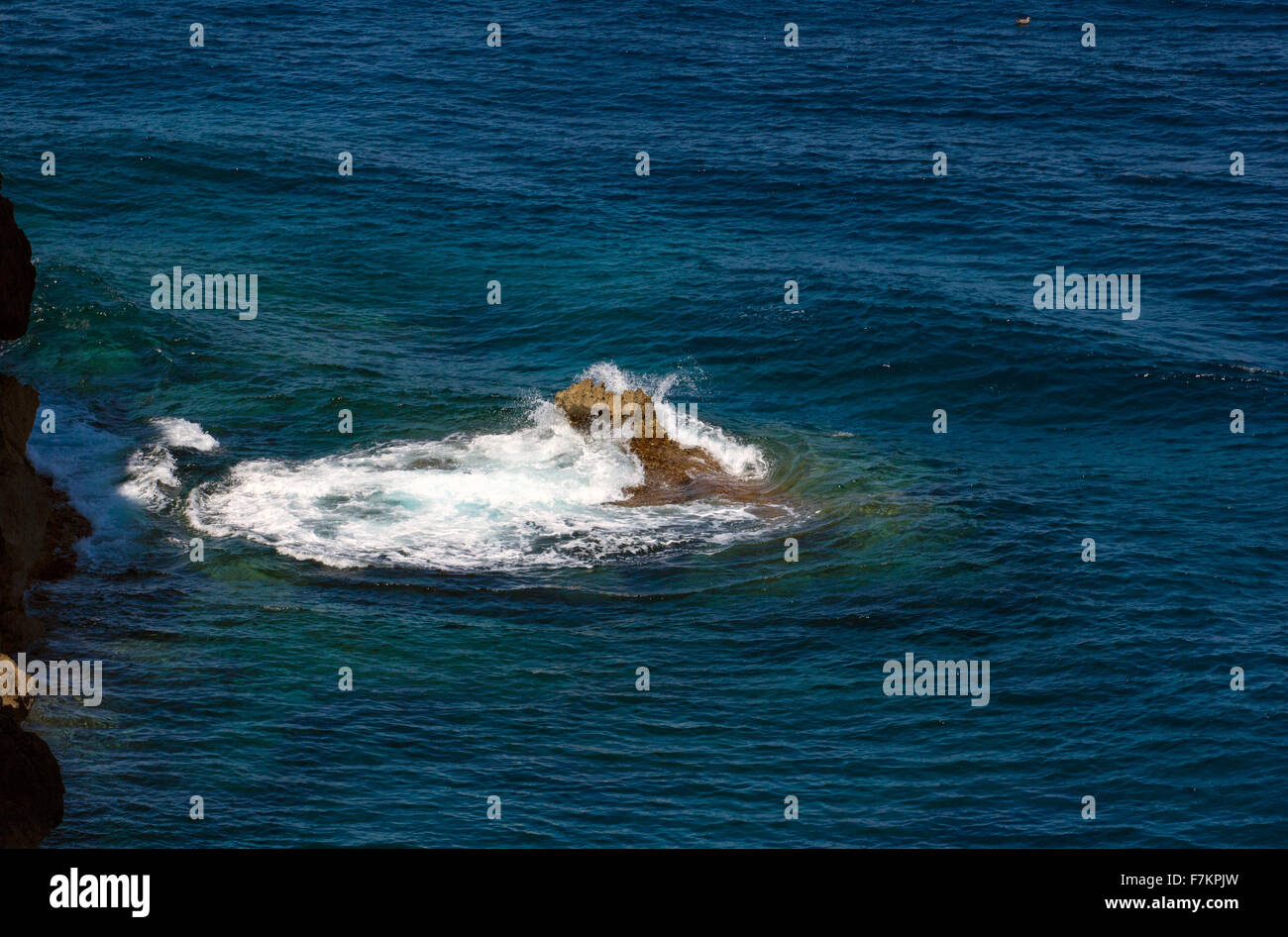 waves hitting rocks near Port de Soller Stock Photo