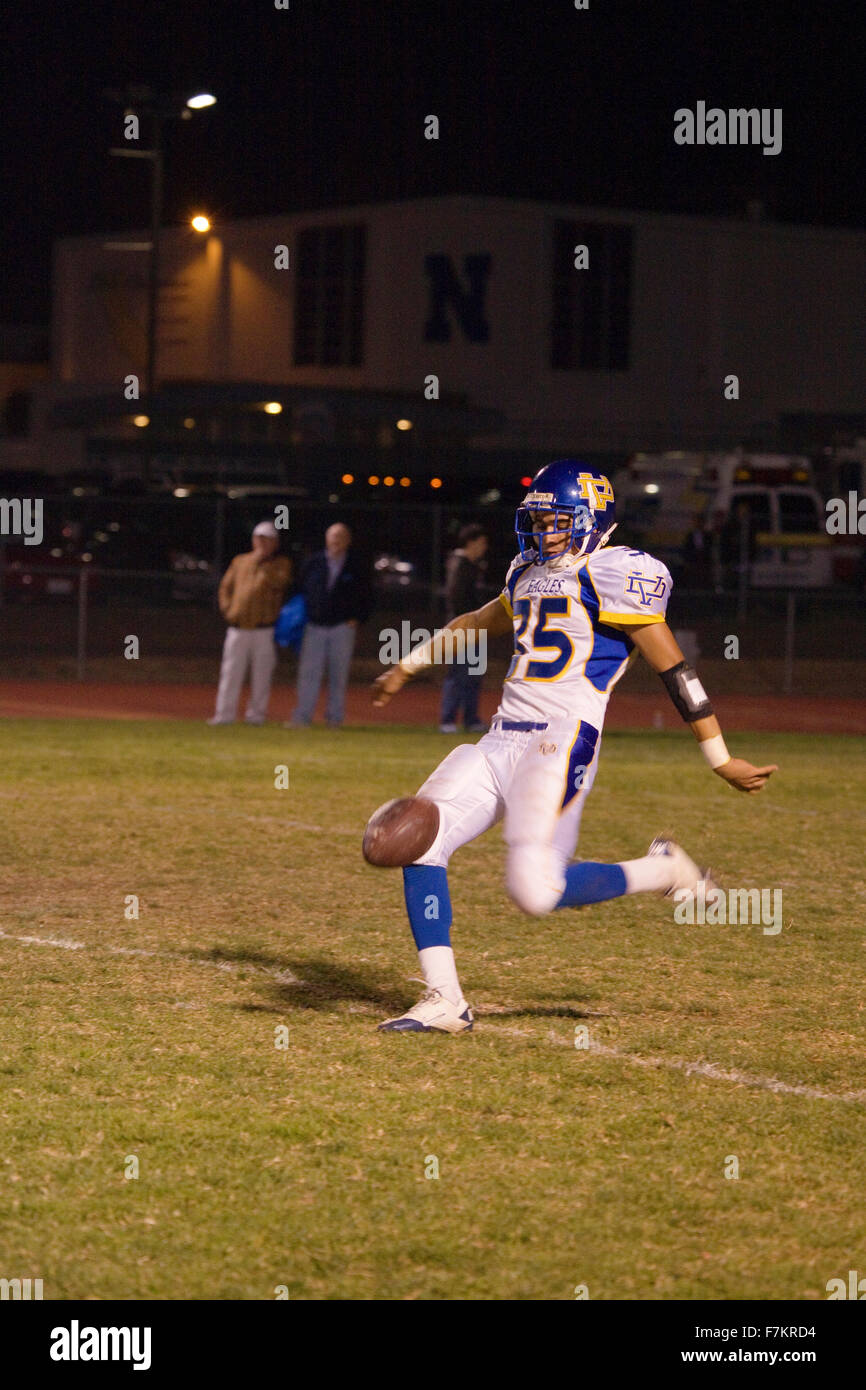 High school football player punts as Ojai Nordhoff Rangers Football team defeats Verbum Dei Eagles 21-0 on November 19, 2010, Ojai, CA, USA Stock Photo