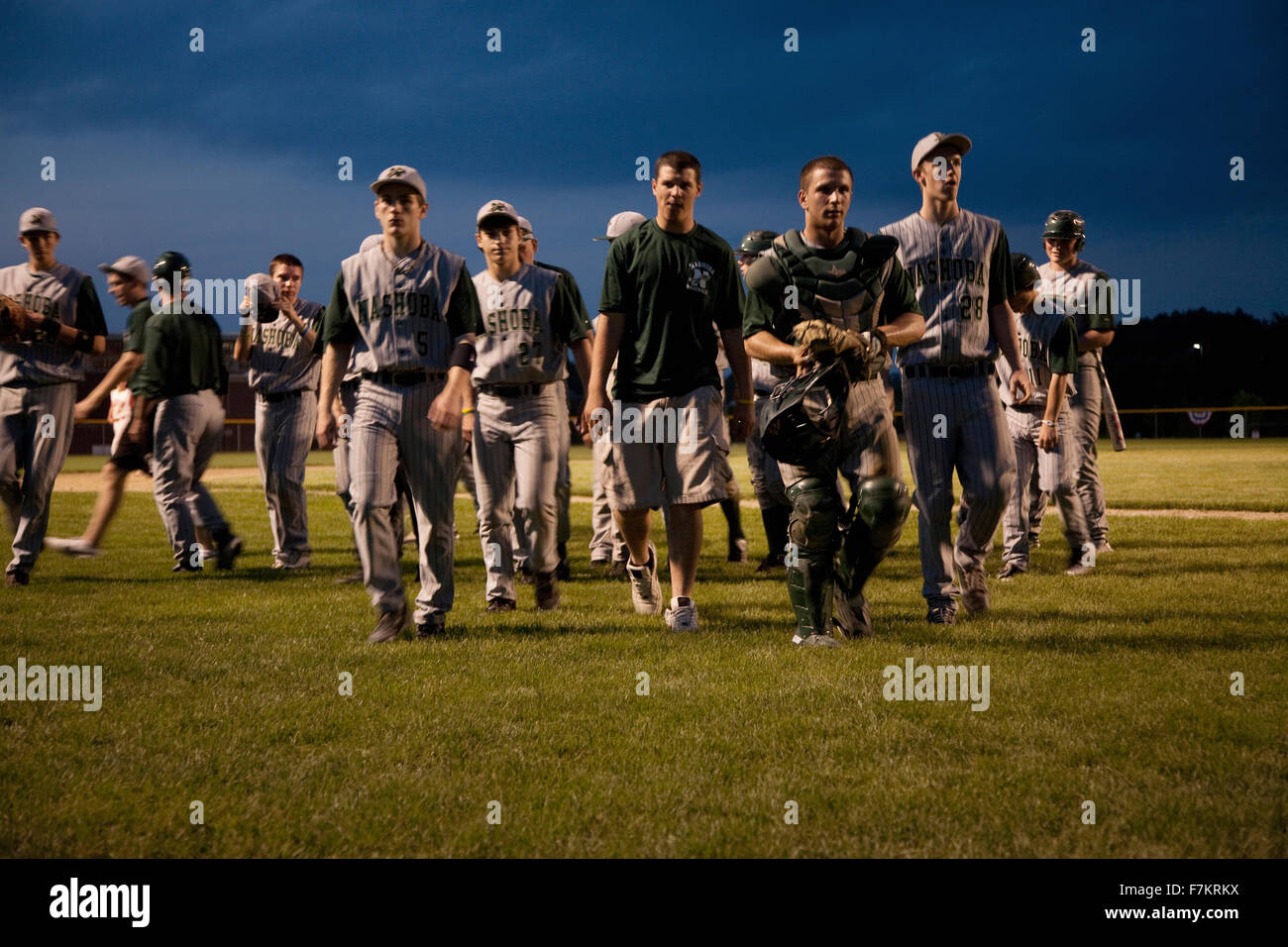 High school baseball features Nashoba Chieftans playing a nightgame in Western MA outside of Boston Stock Photo