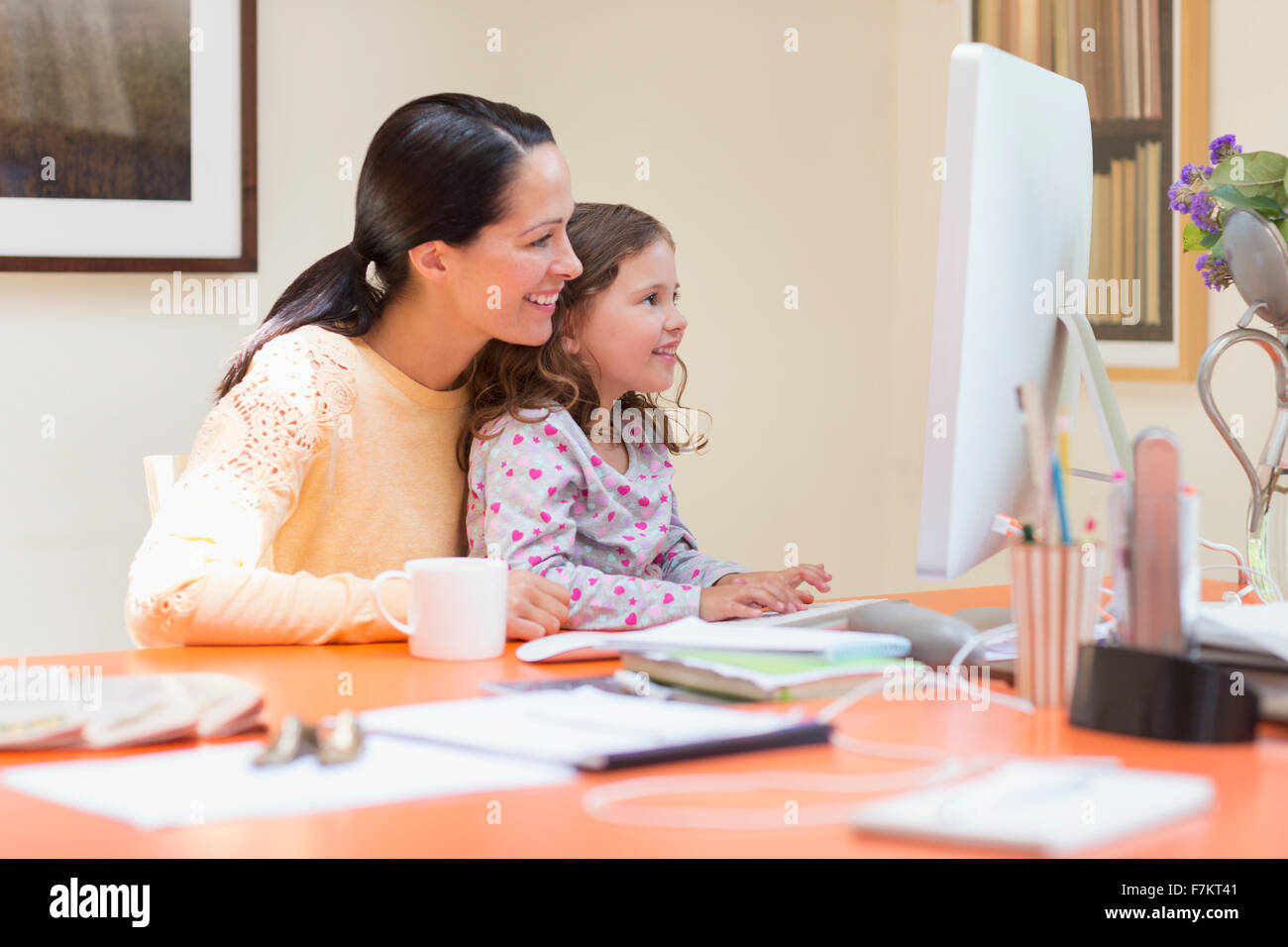 Mother and daughter using computer Stock Photo