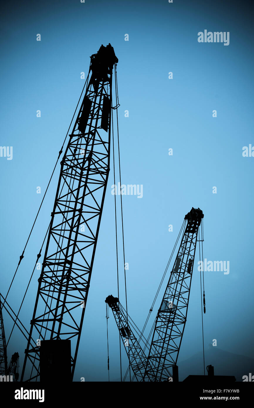 Silhouette of cranes against clear sky Stock Photo - Alamy