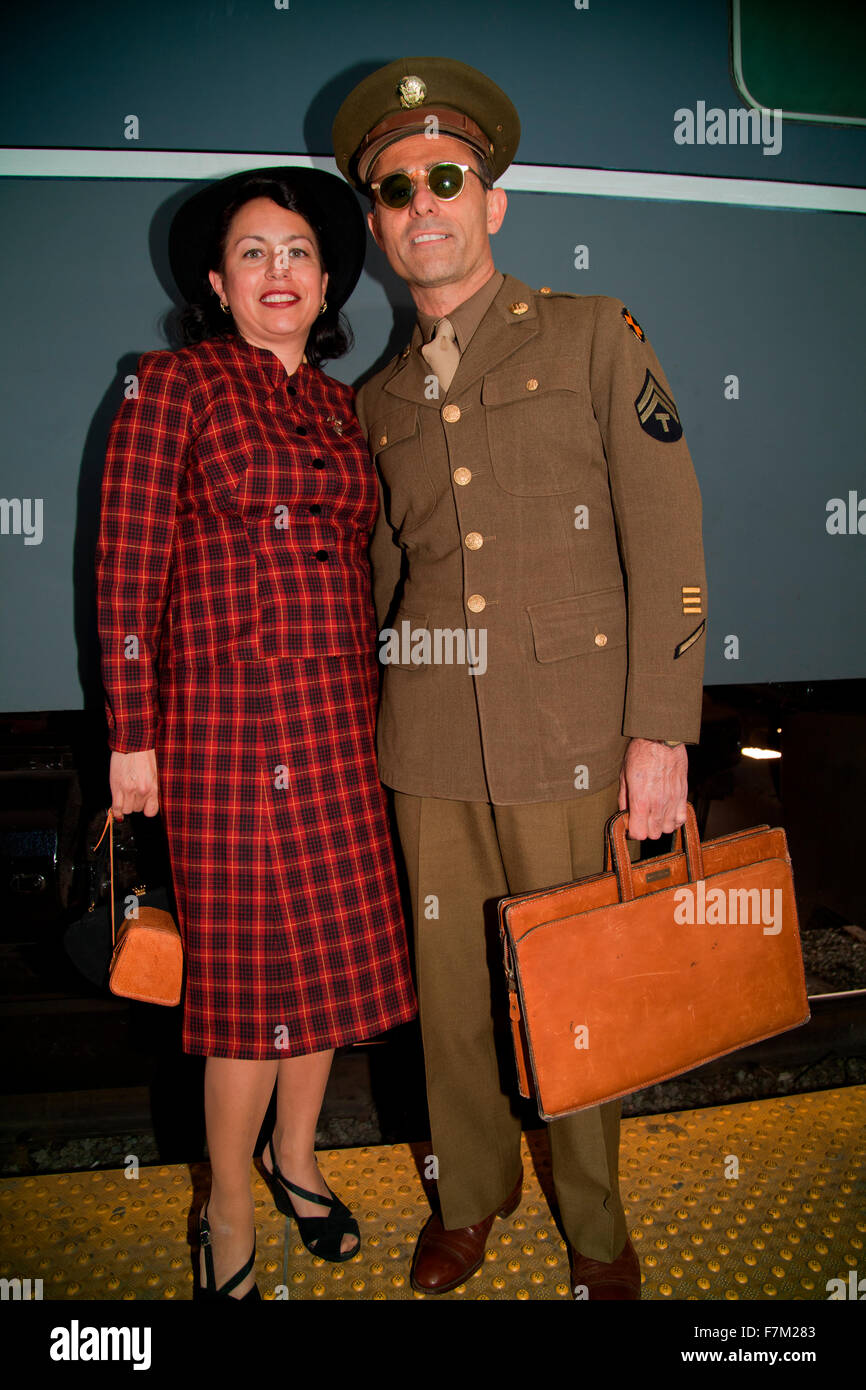 1940's Serviceman and wife pose in front of Pearl Harbor Day Troop train reenactment from Los Angeles Union Station to San Diego Stock Photo