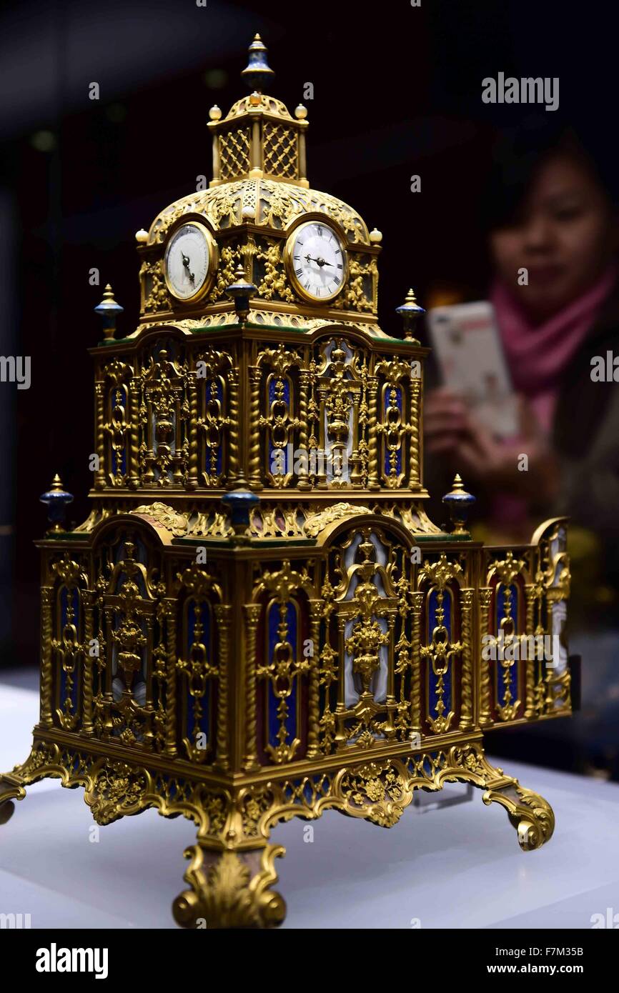 Jinan, China's Shandong Province. 1st Dec, 2015. A gold-plated clock used by ancient Chinese emperors is exhibited at the Shandong Museum in Jinan, capital of east China's Shandong Province, Dec. 1, 2015. The exhibition shows some foreign products used by Chinese emperors in Qing Dynasty (1644-1911). The collections were offered by the Forbidden City in Beijing, also known as the Palace Museum. © Guo Xulei/Xinhua/Alamy Live News Stock Photo