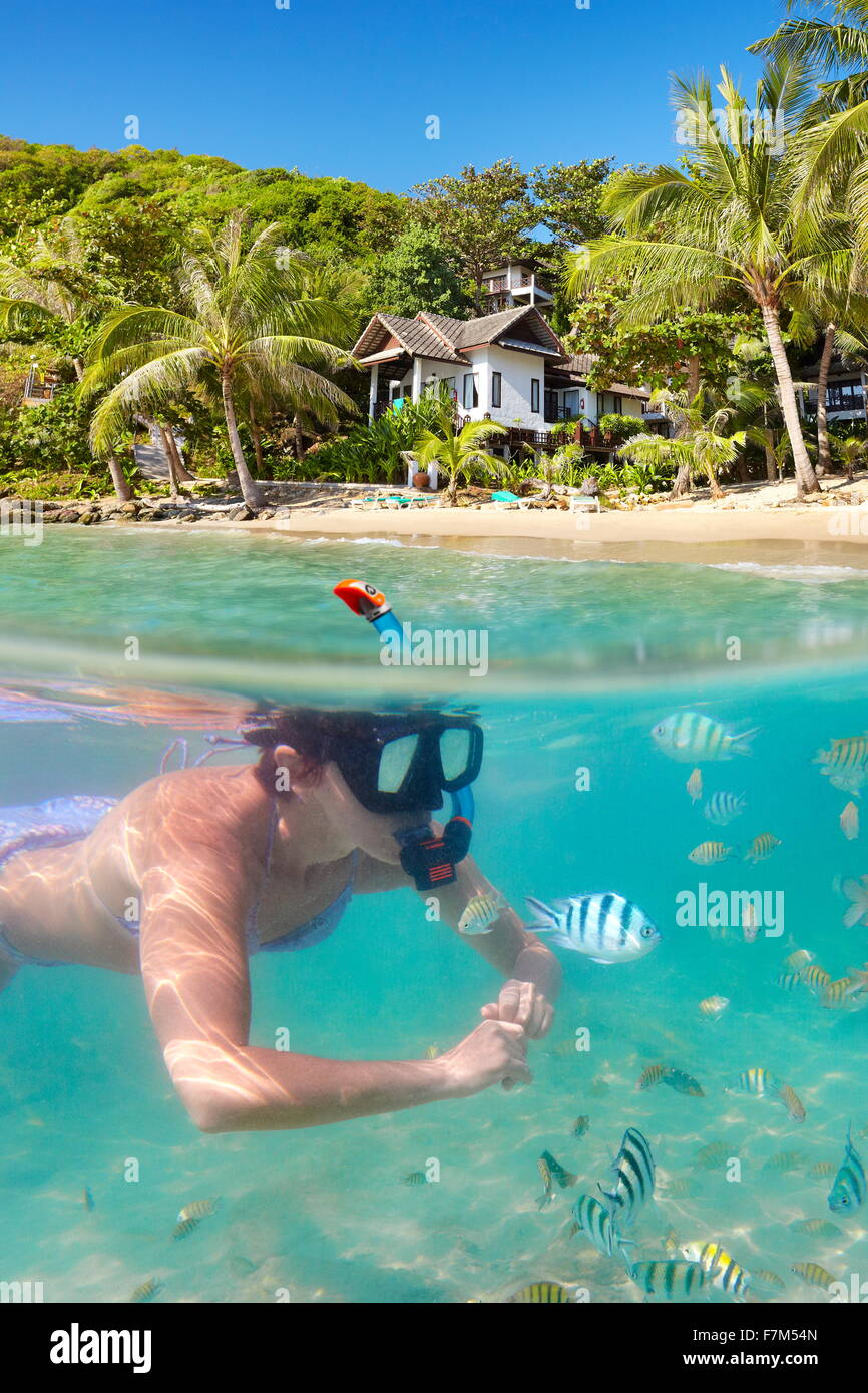 Tropical Ko Samet Island, underwater view of snorkeling woman and fish, Thailand, Asia Stock Photo