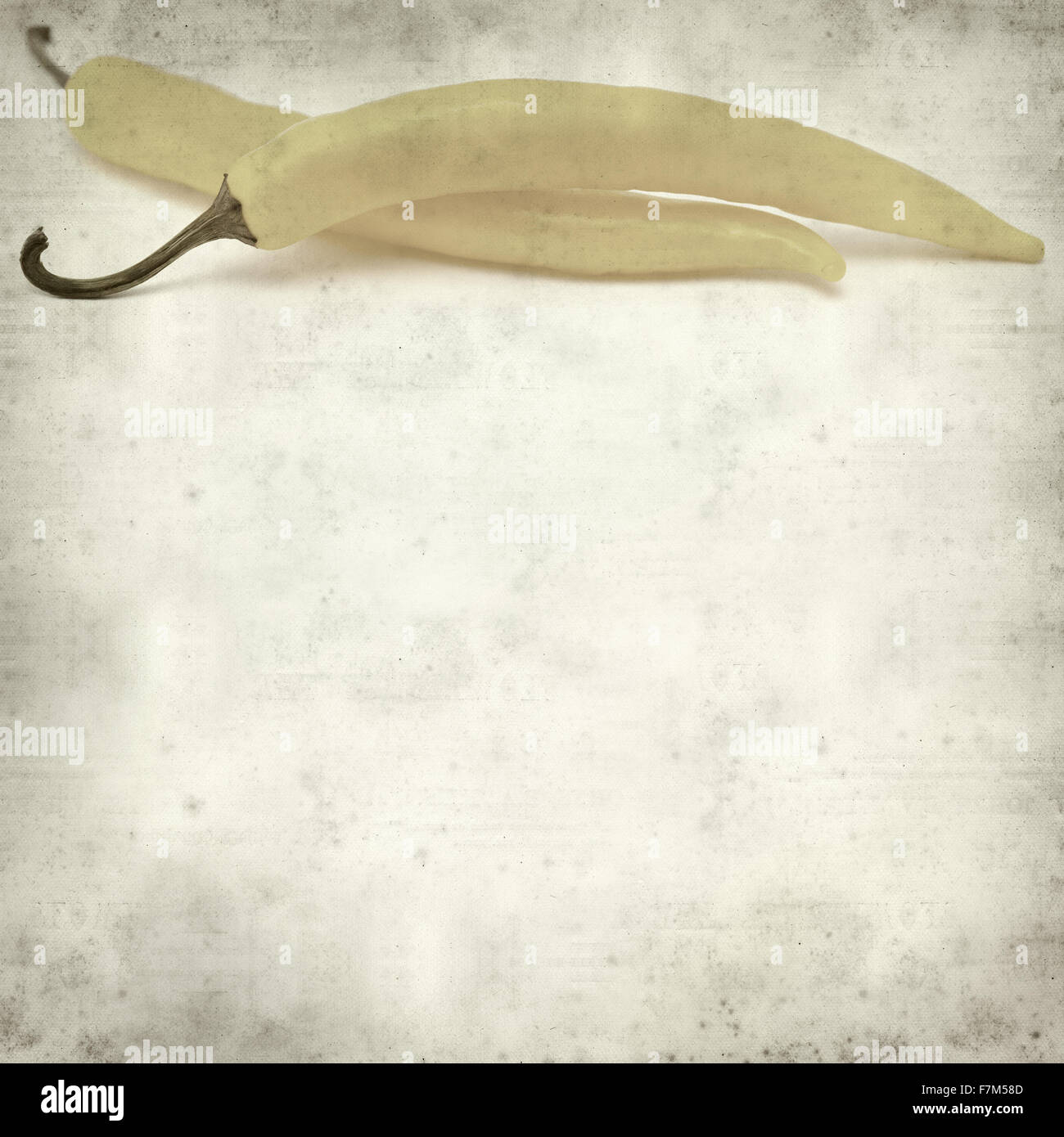 textured old paper background with yellow chilli pepper Stock Photo - Alamy