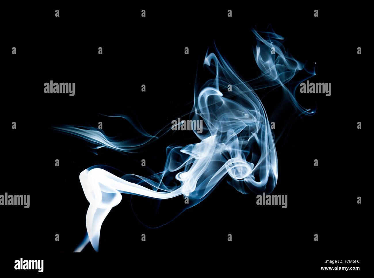 Wisp of smoke on black background Stock Photo - Alamy