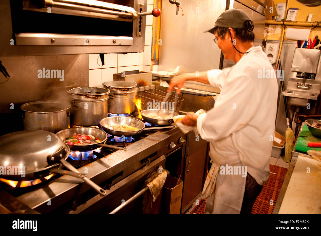 Chef cooks meal in seafood restaurant on Hanover Street, North End