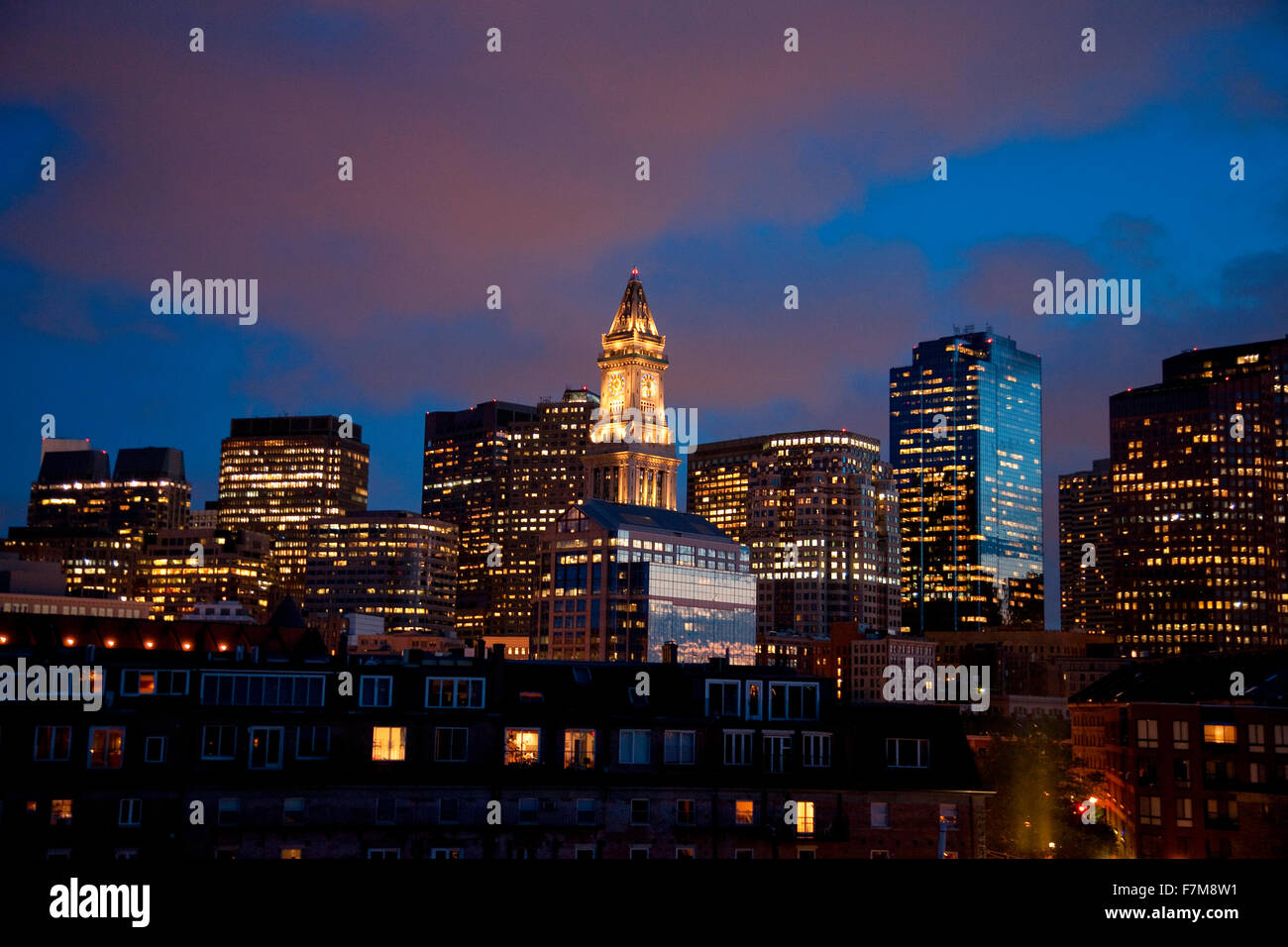 Sunset reflects in windows of Boston skyline and Commerce House Tower ...