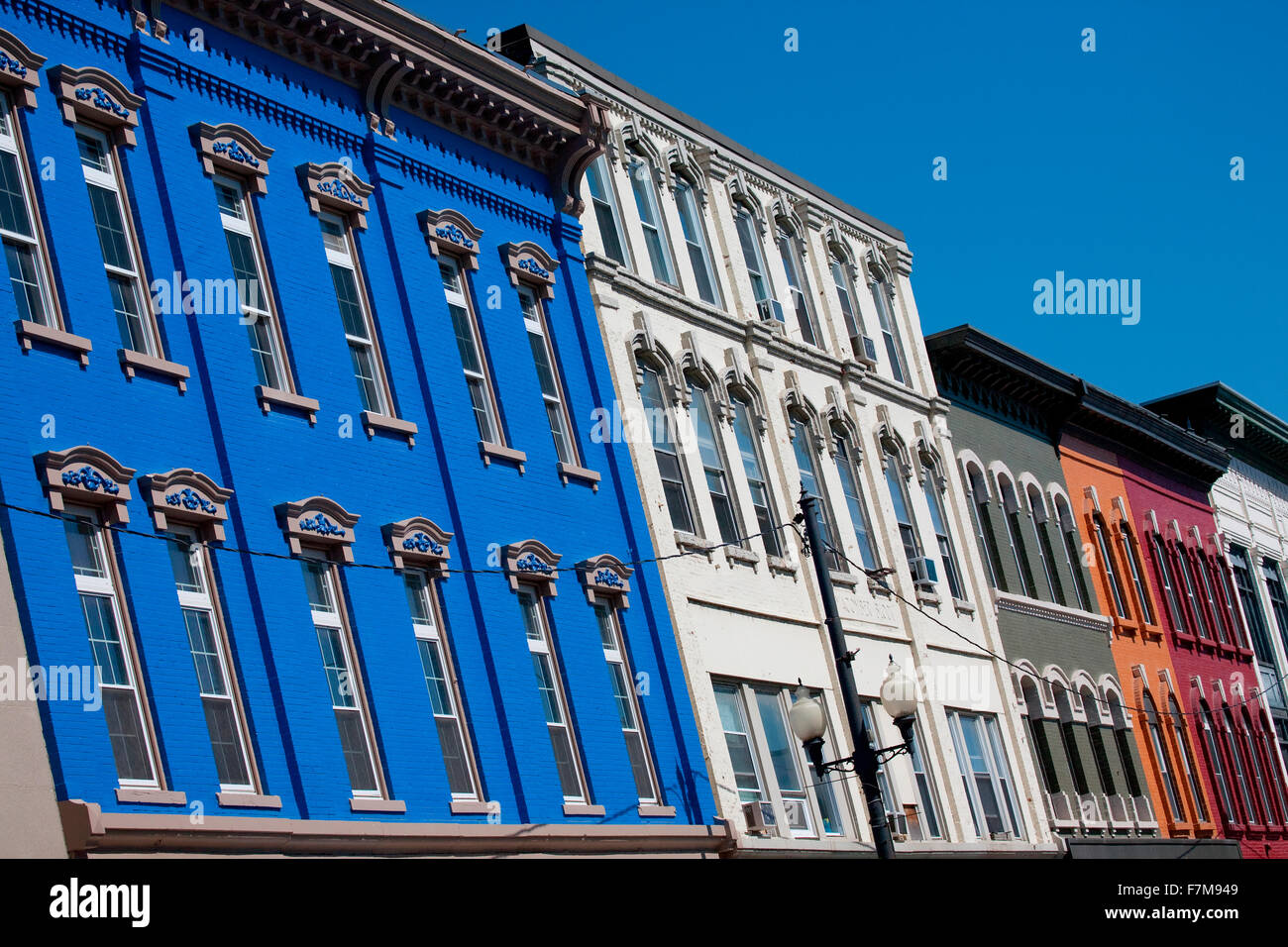 Brightly colored store fronts are cropped at angle in historic waterfront area of Augusta, Maine Stock Photo
