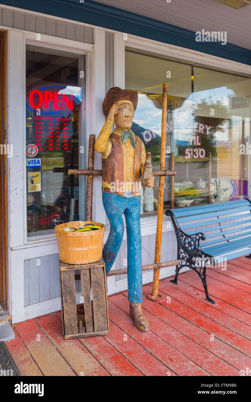 Carved cowboy outside store, Quilchena, near Merritt, British Columbia