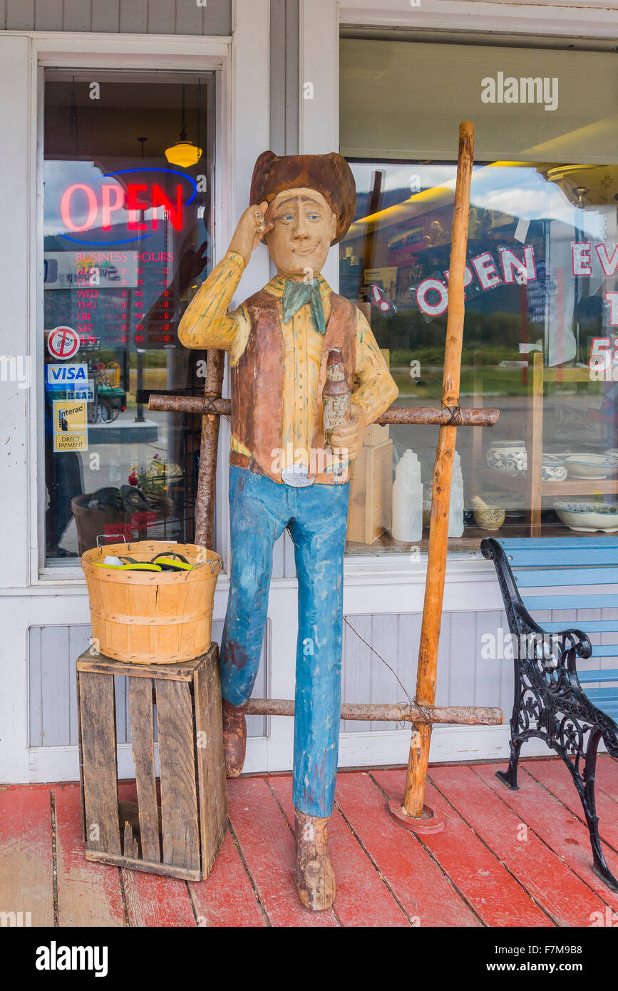 Carved cowboy outside store, Quilchena, near Merritt, British Columbia