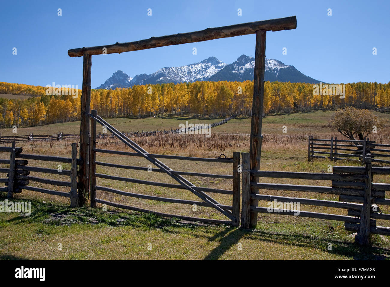 Wooden fence frames San Juan Mountains, Last Dollar Ranch, Hastings Mesa, near Ridgeway, CO Stock Photo