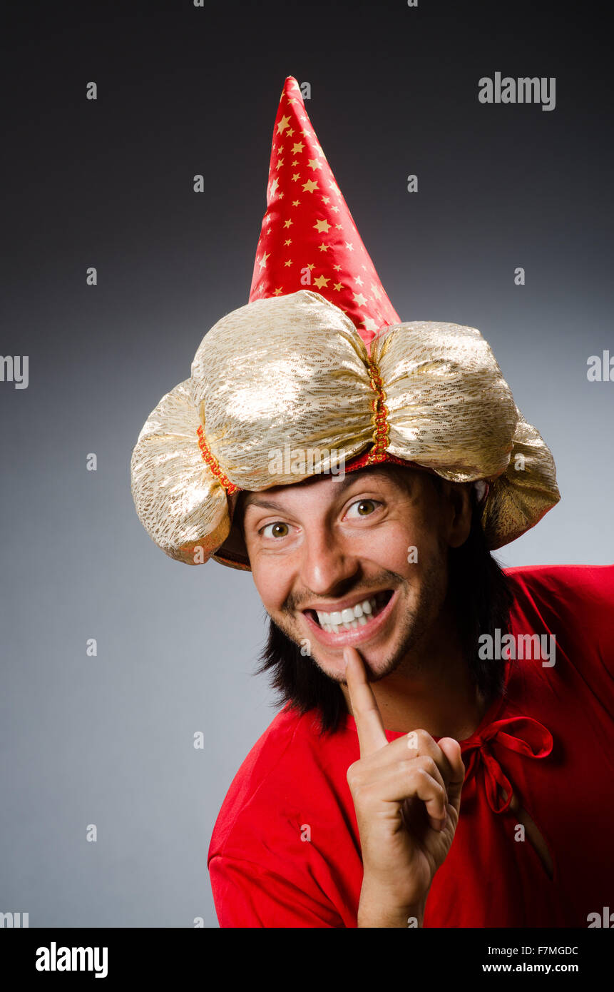 Funny wizard wearing red dress Stock Photo - Alamy