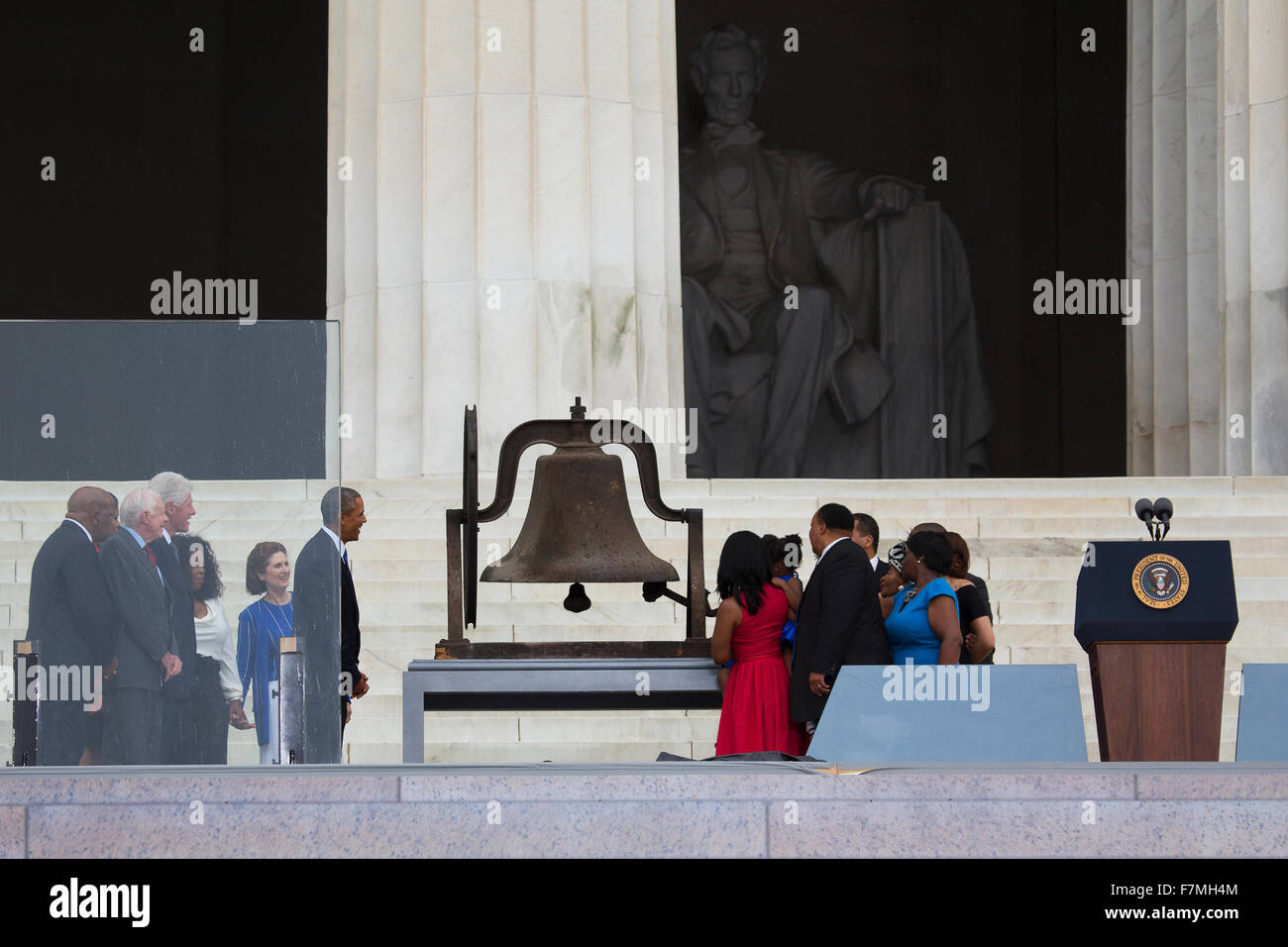 US President Barack Obama, former president Jimmy Carter and Bill Clinton watch as members of the late Dr. Martin Luther King, Jr.'s family ring a bell during the Let Freedom Ring Commemoration and Call to Action to commemorate the 50th anniversary of the Stock Photo