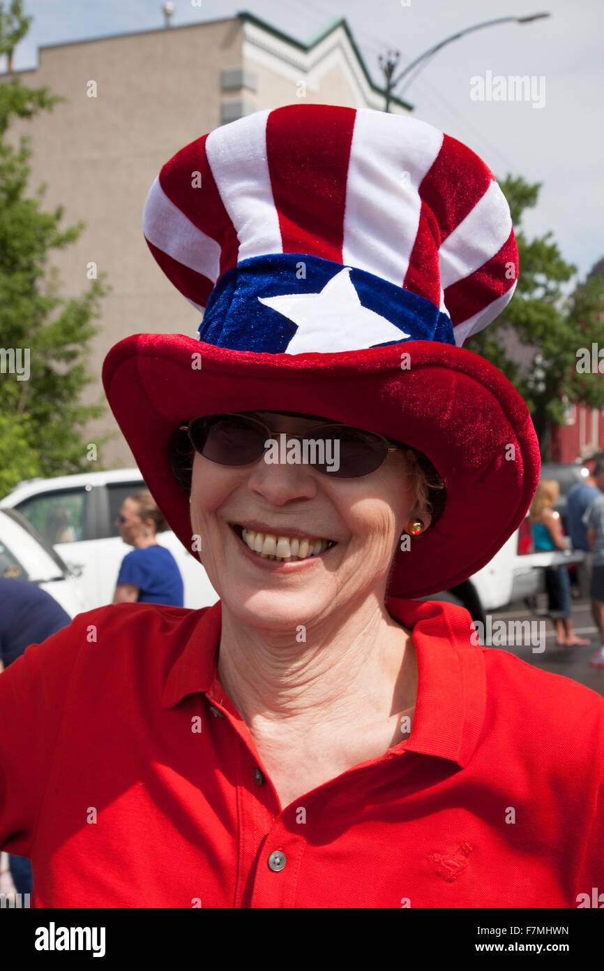 Woman smiles with Uncle Sam hat on July 4 Independence Day Parade, Ouray, Colorado Stock Photo