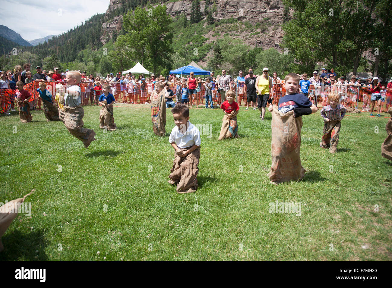 Young boys compete in Three Legged race in Ouray, Colorado, July 4, Indpendence Day annual picnic event Stock Photo