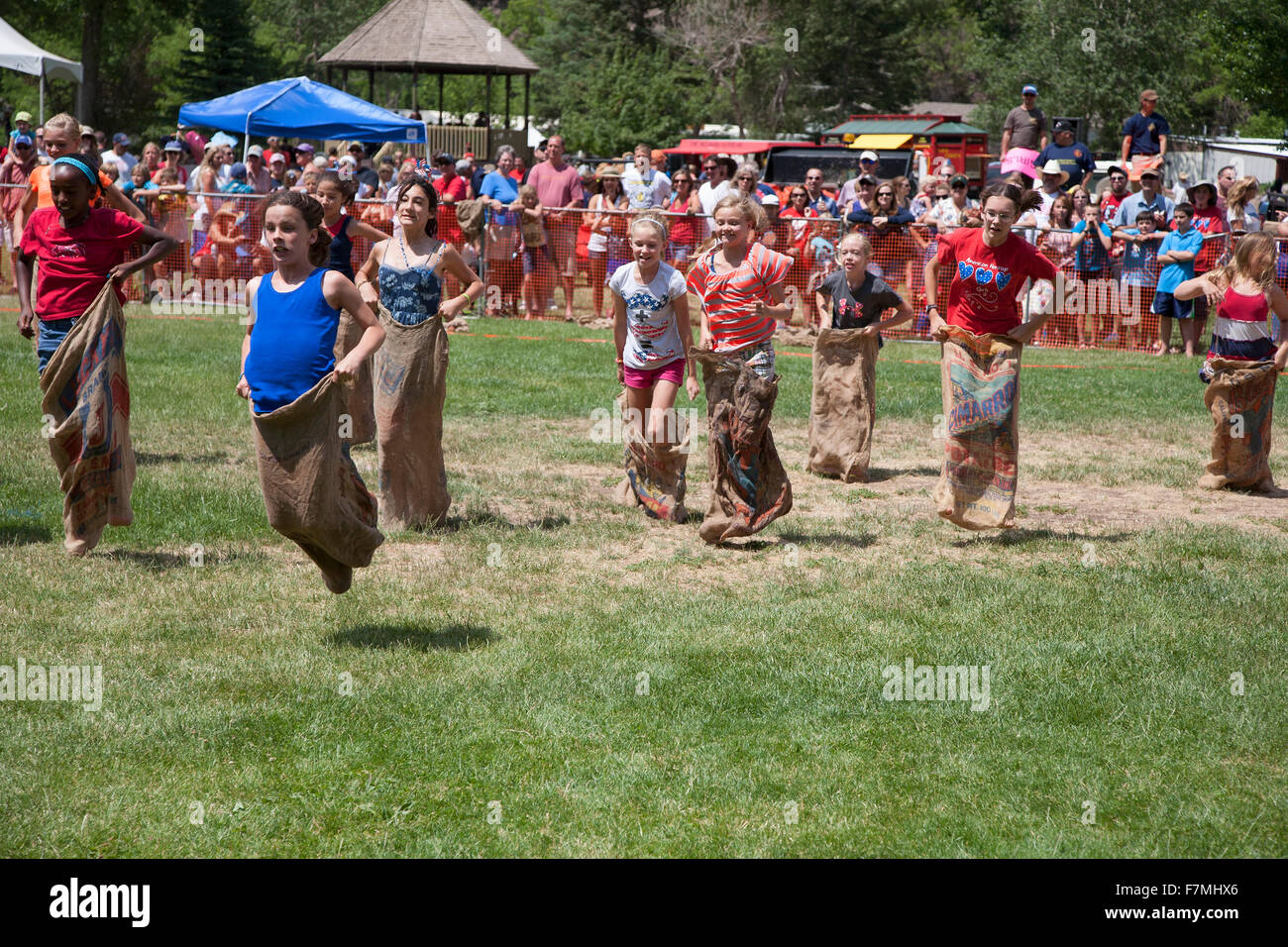 Young girls compete in Three Legged race in Ouray, Colorado, July 4, Indpendence Day annual picnic event Stock Photo