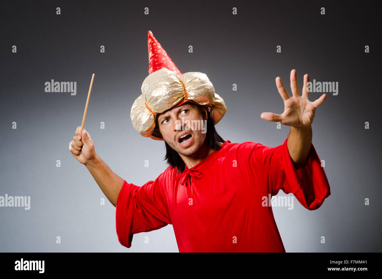 Funny wizard wearing red dress Stock Photo - Alamy