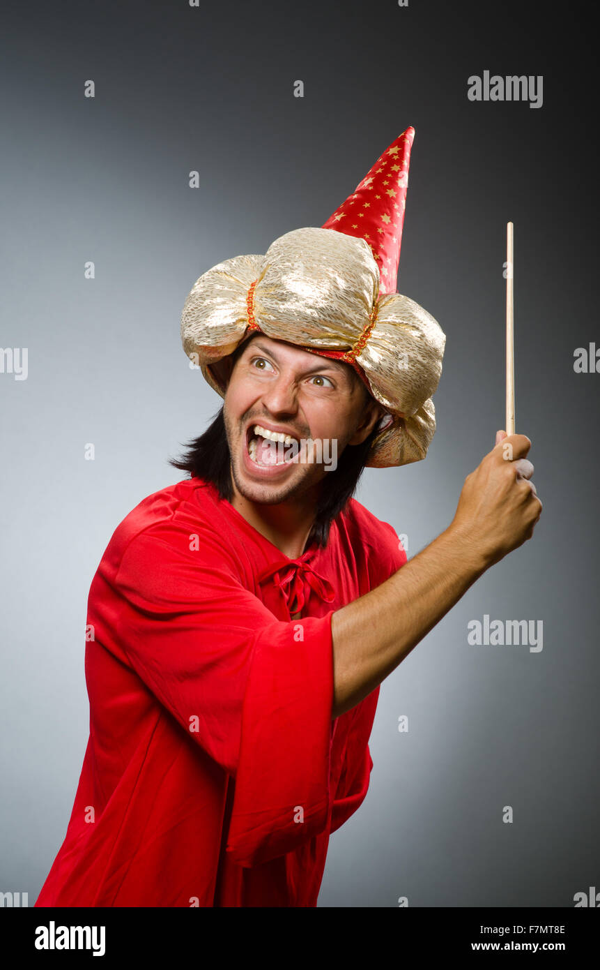 Funny wizard wearing red dress Stock Photo - Alamy