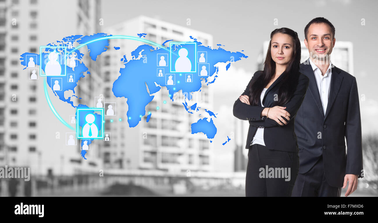 Businesswoman and man stand near map with icons Stock Photo