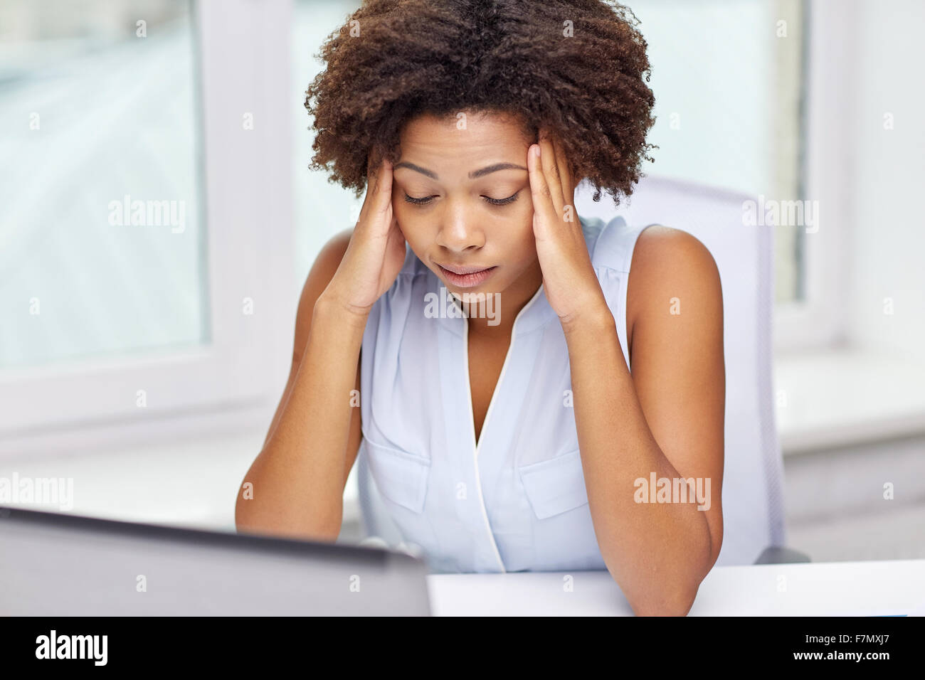 african woman with laptop at office Stock Photo - Alamy