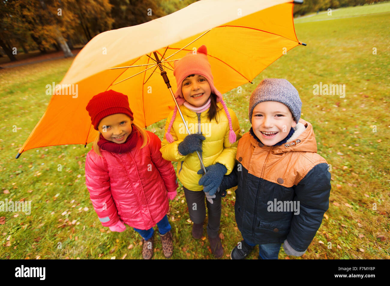 group of happy children in autumn park Stock Photo - Alamy