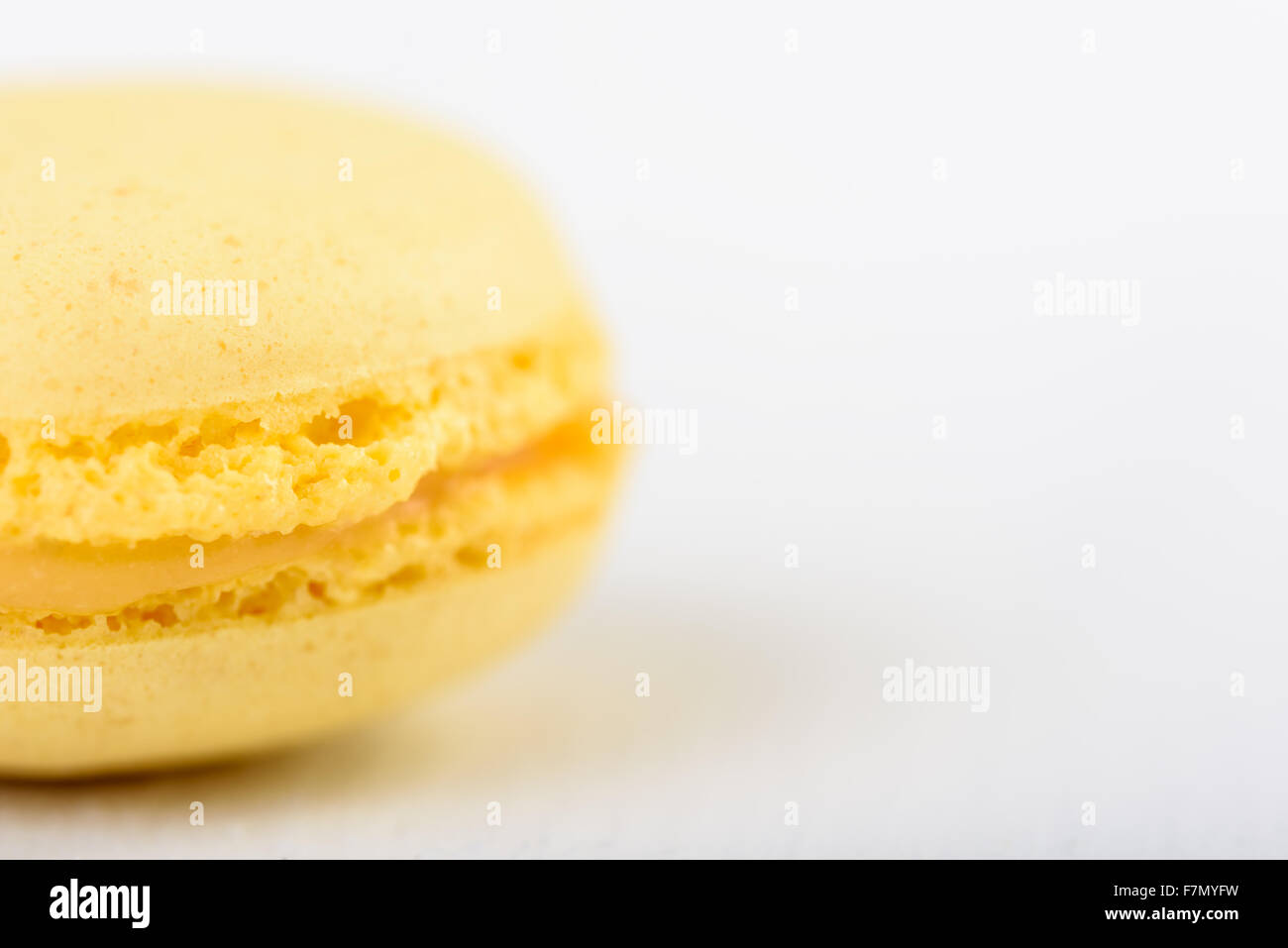 Yellow Lemon French Macaroon On White Wood Boards Background Stock Photo