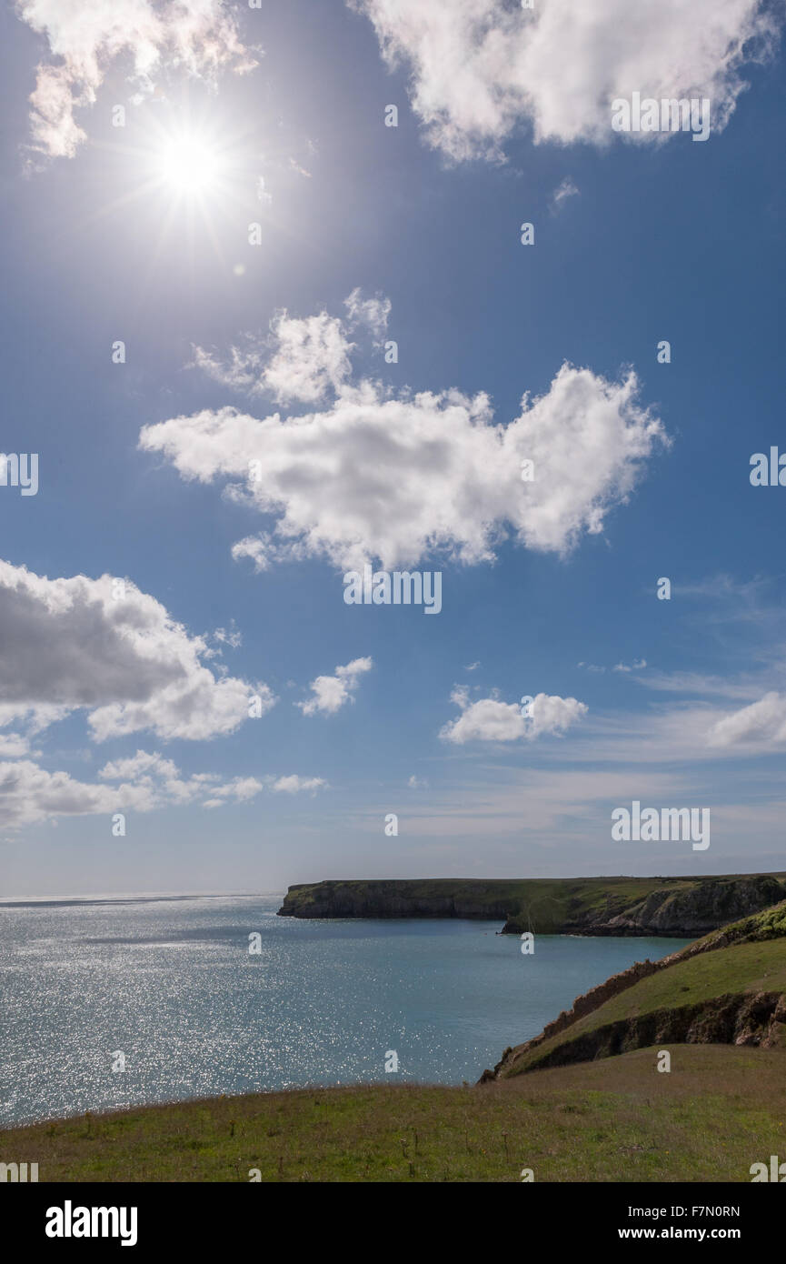 Welsh coast line with blue sky and sun Stock Photo