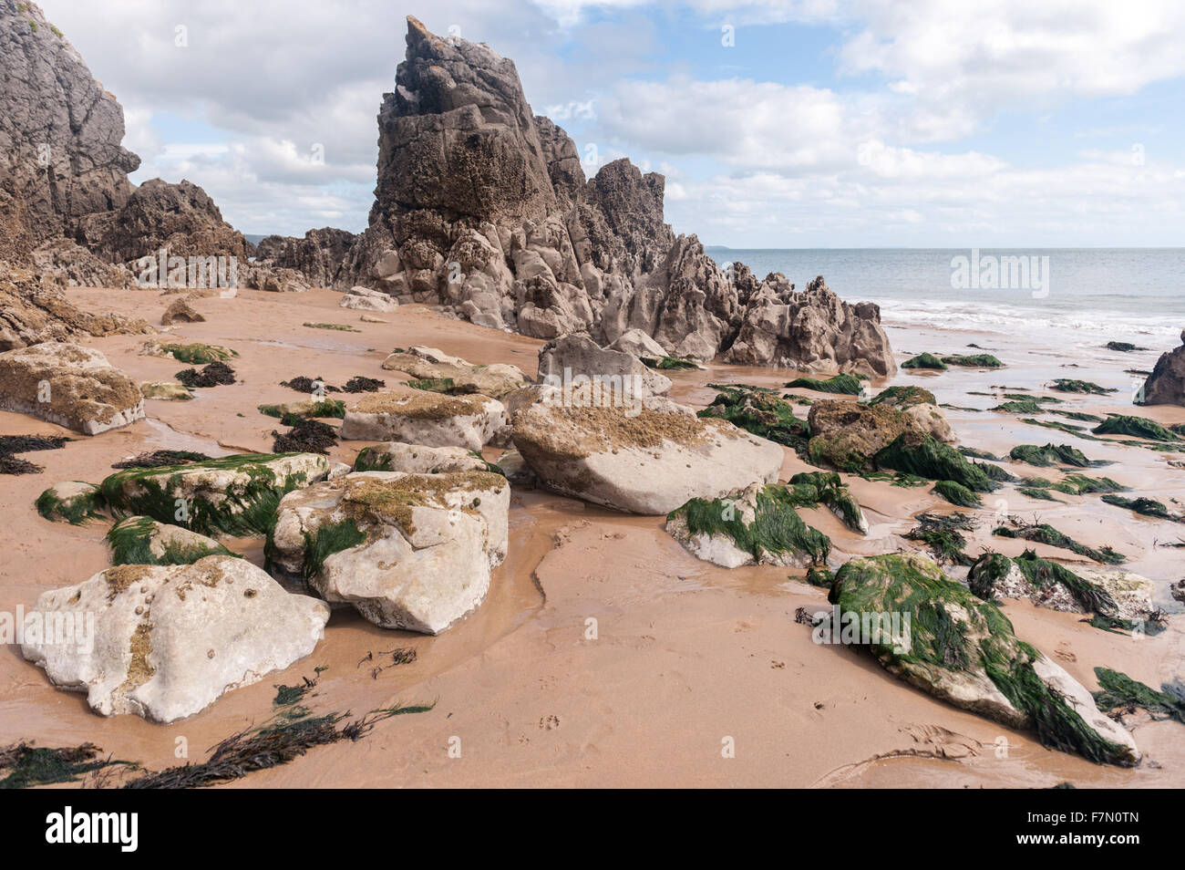 Large and small rocks on beach around coast Stock Photo