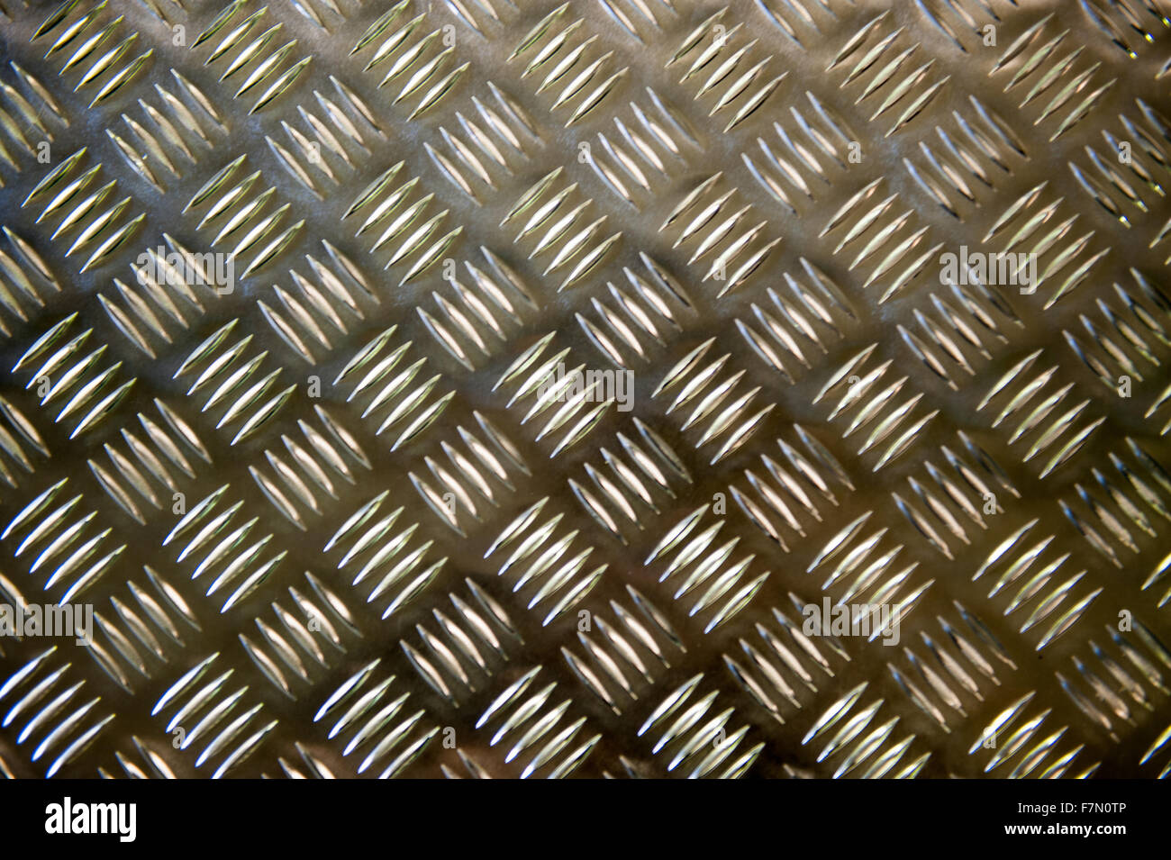 Metallic plate with a grid imposed pattern for gripping Stock Photo