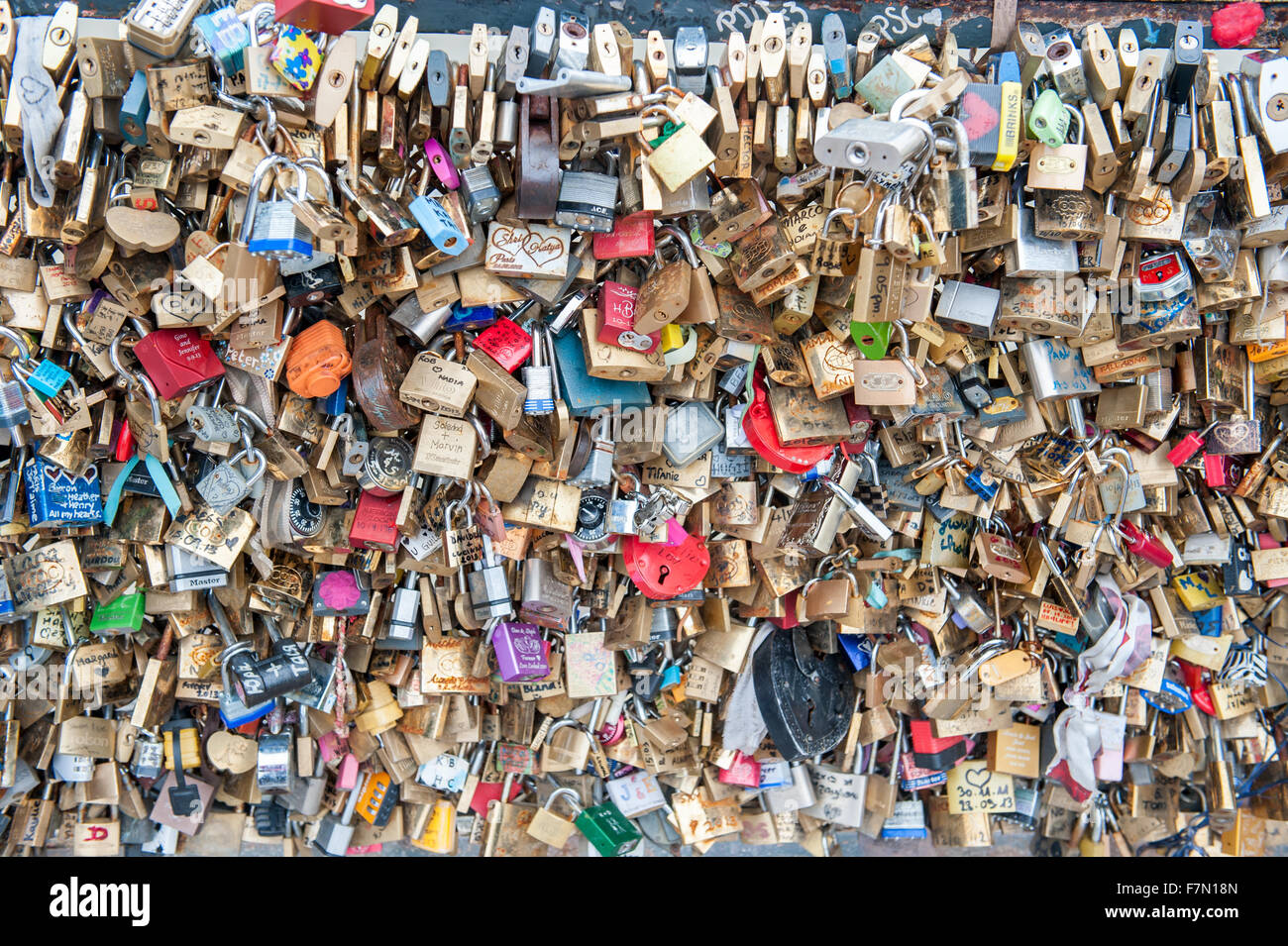 The tradition of leaving pad locks on a bridge to represent love and memories Stock Photo