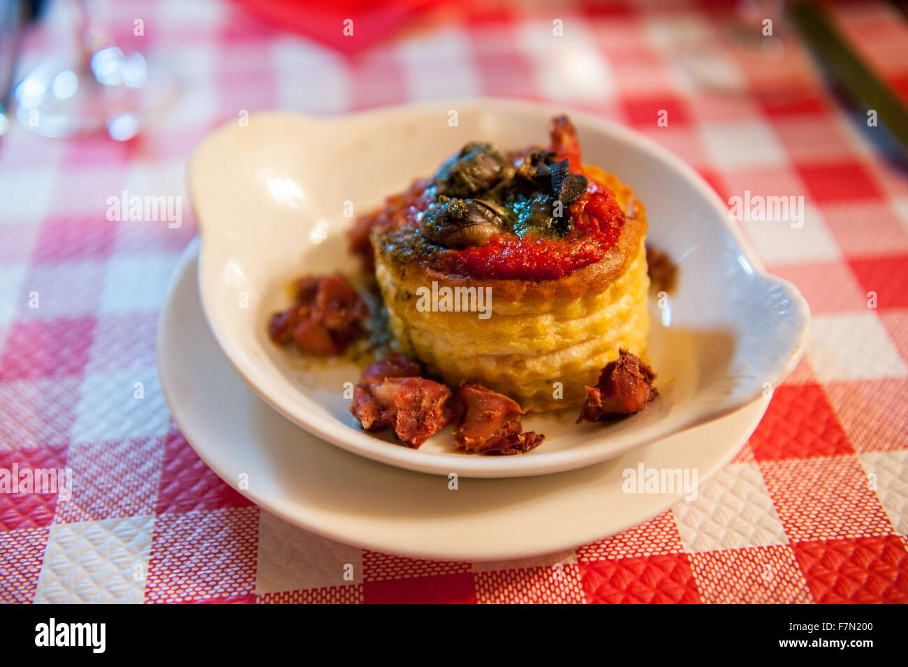 Snails in a puff pastry casing on a dish Stock Photo