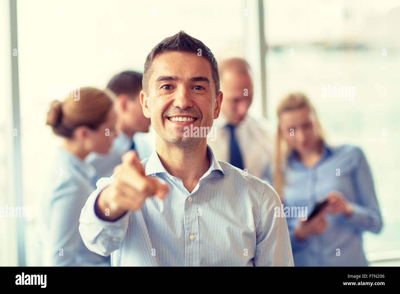 group of smiling businesspeople meeting in office Stock Photo - Alamy